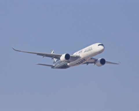 white airplane taking off during daytime