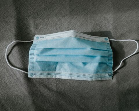 teal and white underwear on gray textile