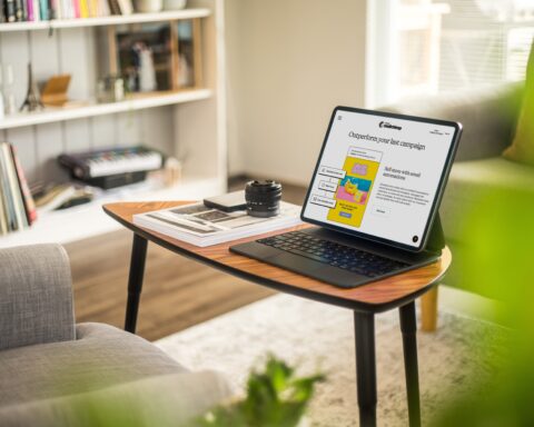 a laptop on a coffee table